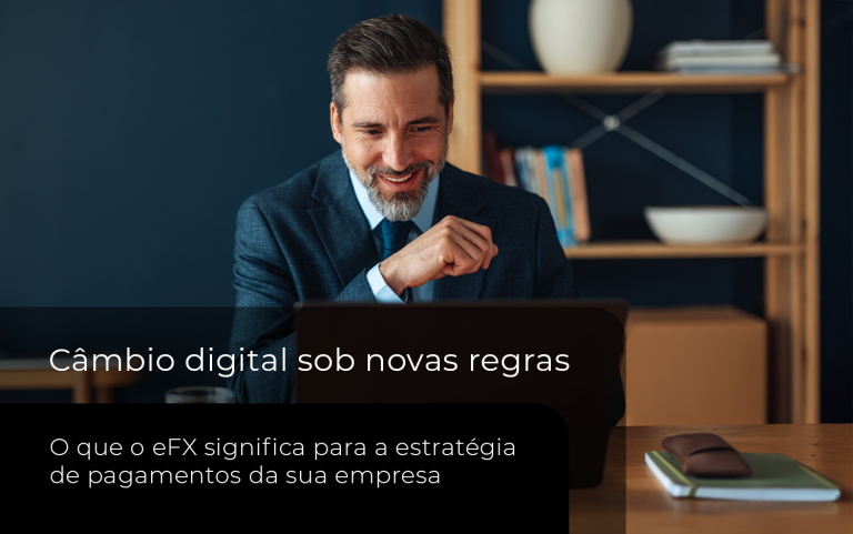 Empresário analisando pagamentos internacionais para empresas em um ambiente corporativo, com notebook e recursos digitais.