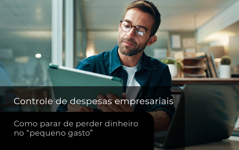 Profissional analisa informações financeiras em um tablet em um ambiente corporativo, representando o controle de despesas empresariais e o acompanhamento dos gastos do negócio.